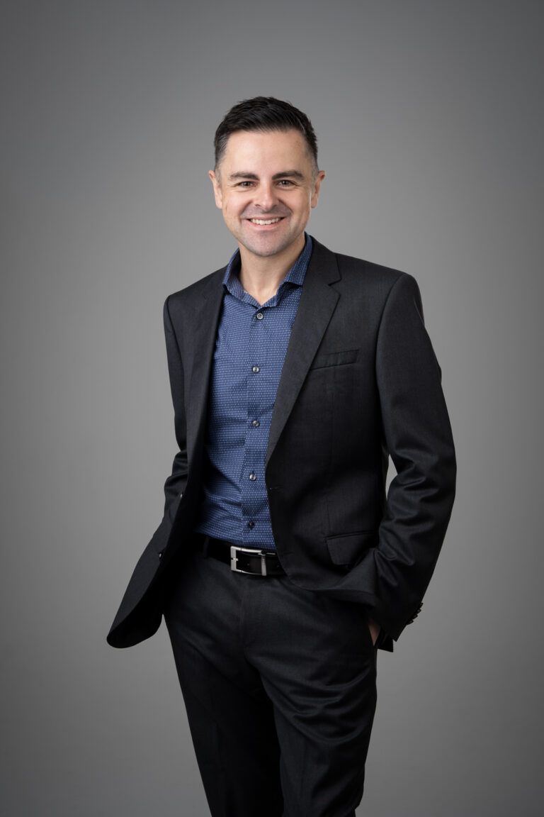 Corporate Headshot against a grey background